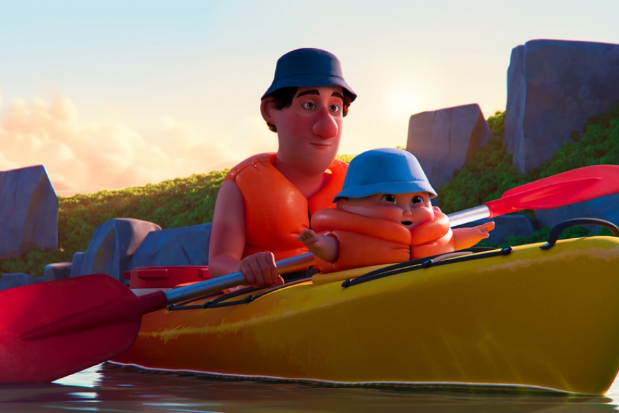 Un bébé et son papa sont sur un canoë. Ils portent tous les deux un chapeau et des bouées de sauvetage. Le bébé est tout boudiné.