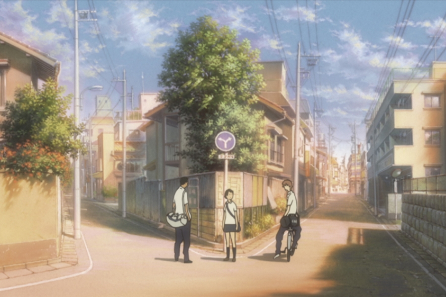 Makoto et deux lycéens discutent au croisement d'une rue.