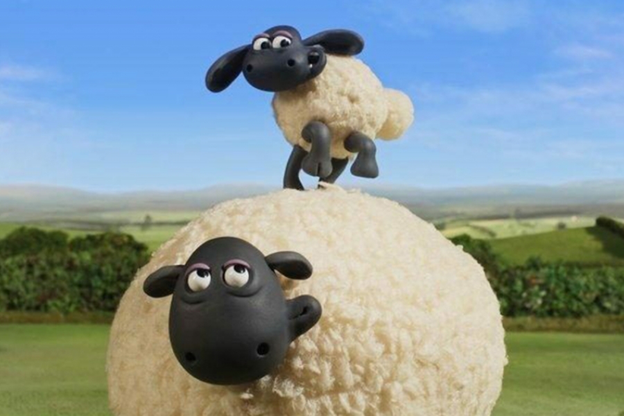 Un petit mouton sur un gros mouton